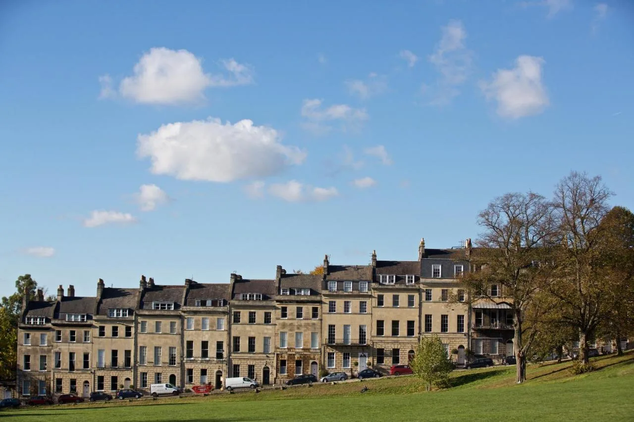 a large building with cars parked in front of it at The Z Hotel Bath in Bath